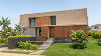 Modern house with wooden facade and greenery