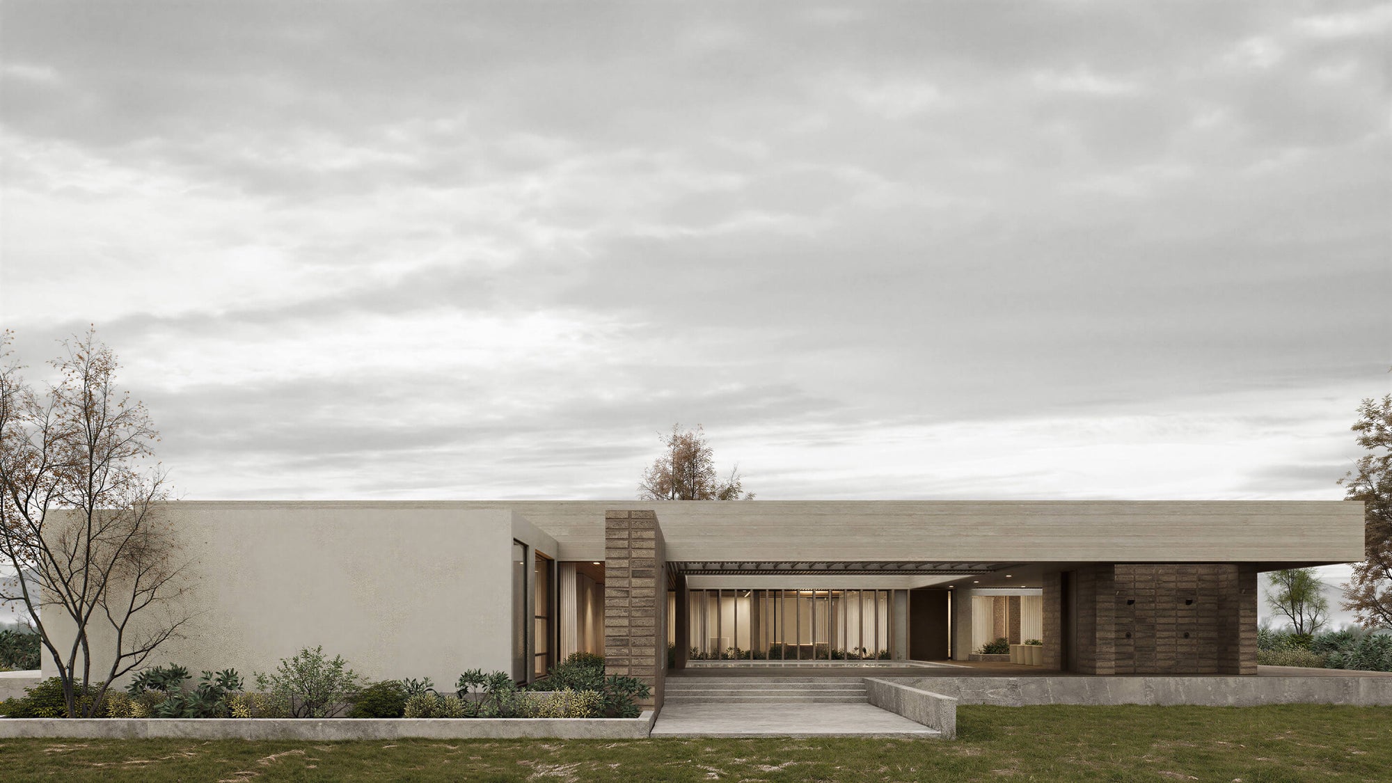 Modern house with a flat roof and large windows, set against a cloudy sky.