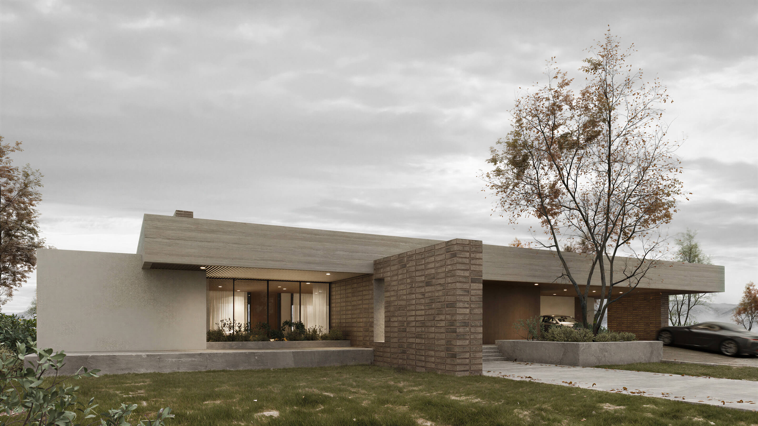 Modern house with a flat roof and stone accents on a cloudy day.