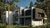 Modern house with white and gray exterior in a forest setting