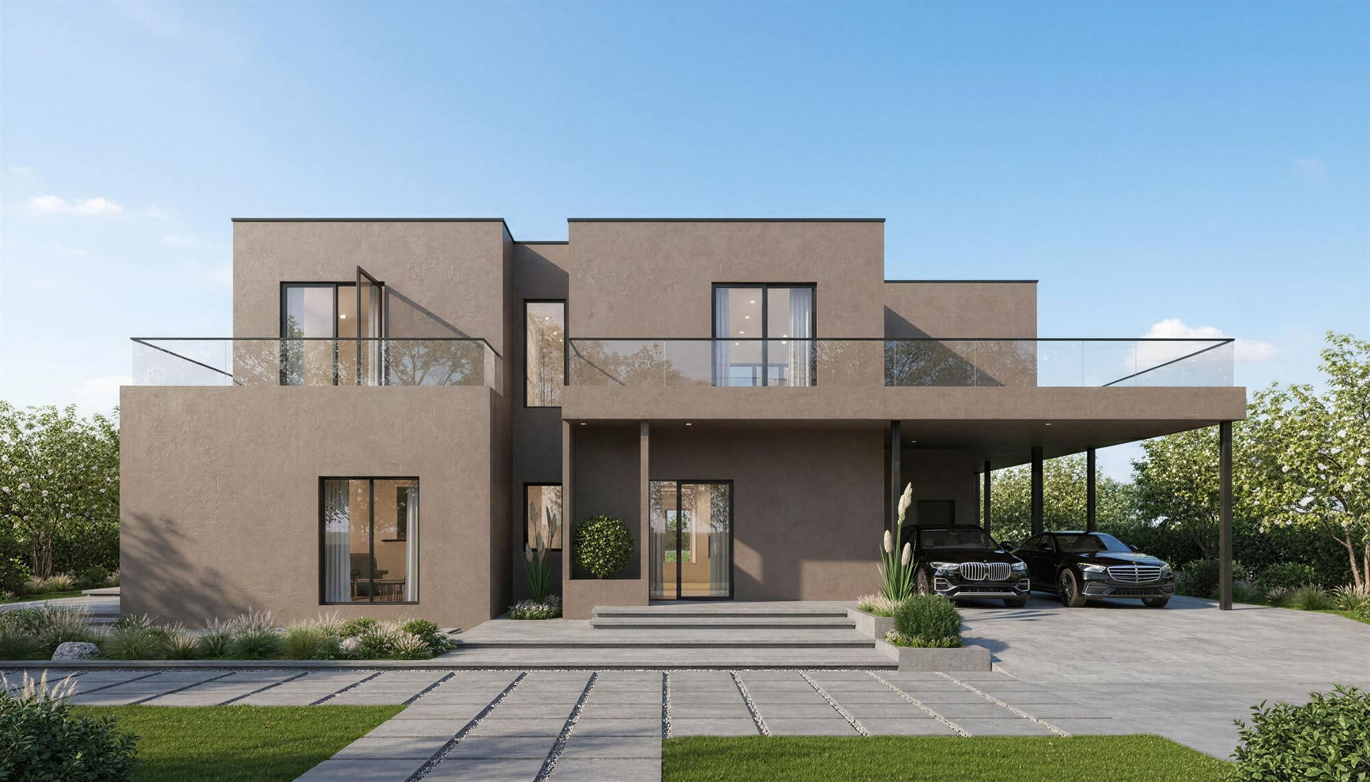 Modern house with a driveway and cars on a clear day