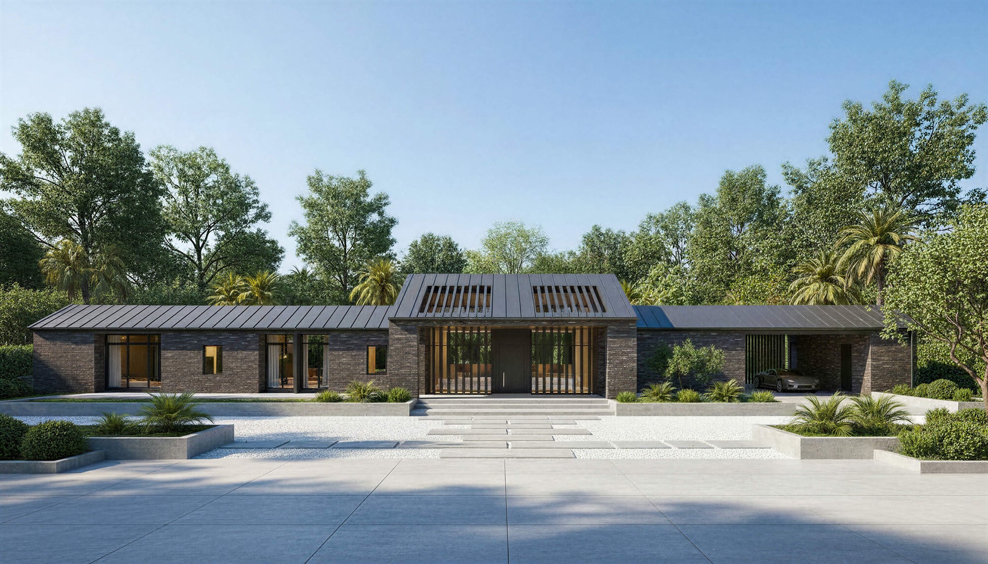 Modern house with a flat roof and large windows, surrounded by trees and a clear sky.
