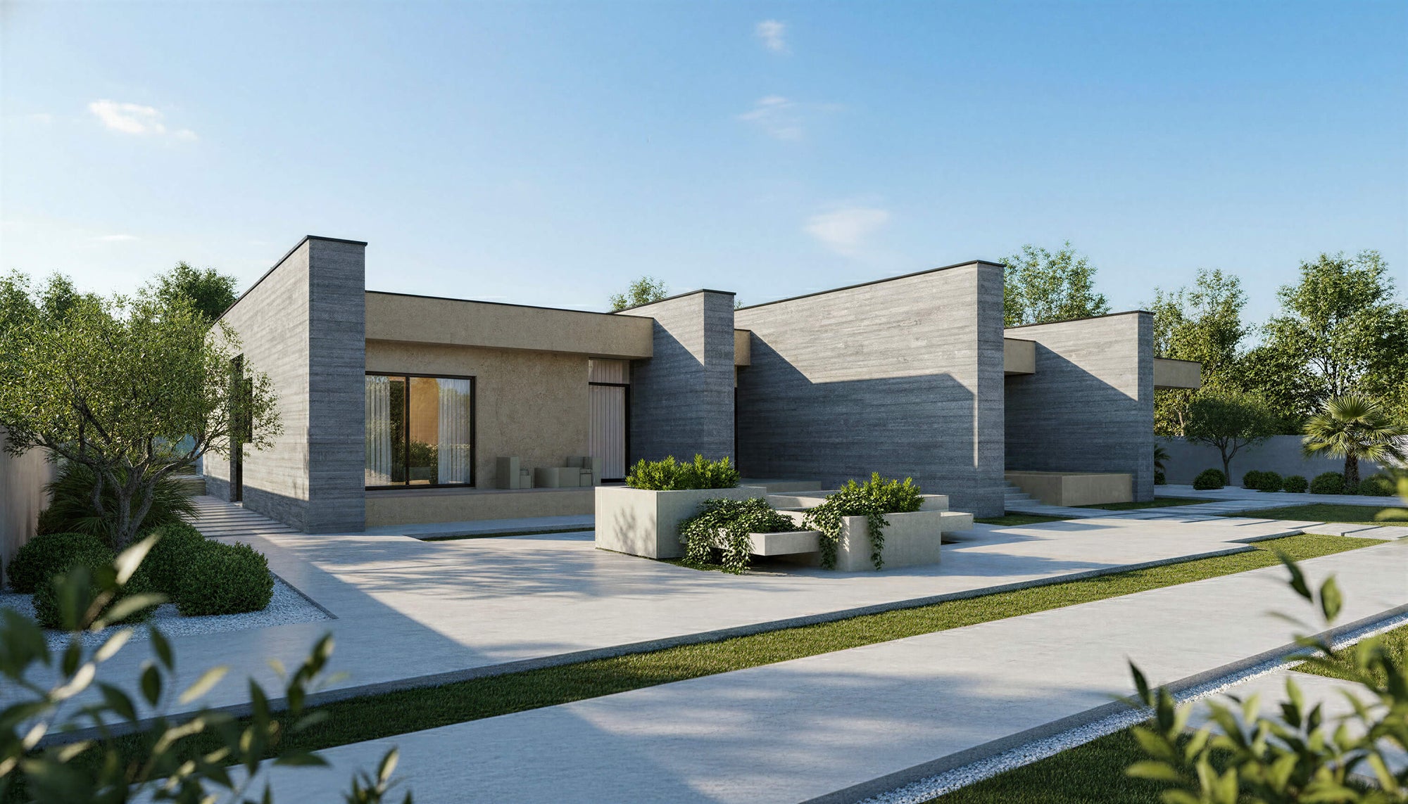 Modern house with a driveway and garden under a clear blue sky