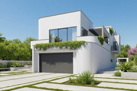 Modern white house with greenery on a clear day