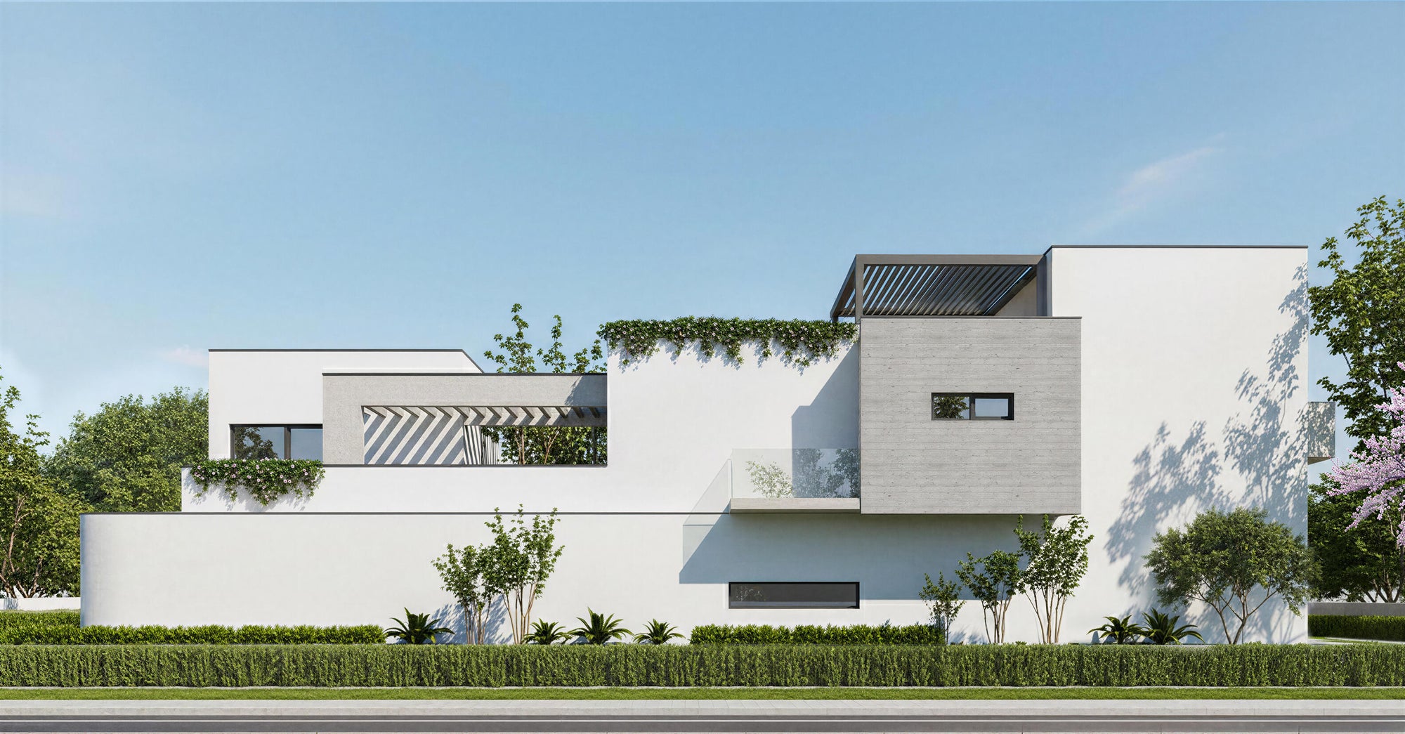 Modern house with white exterior and greenery in a suburban setting