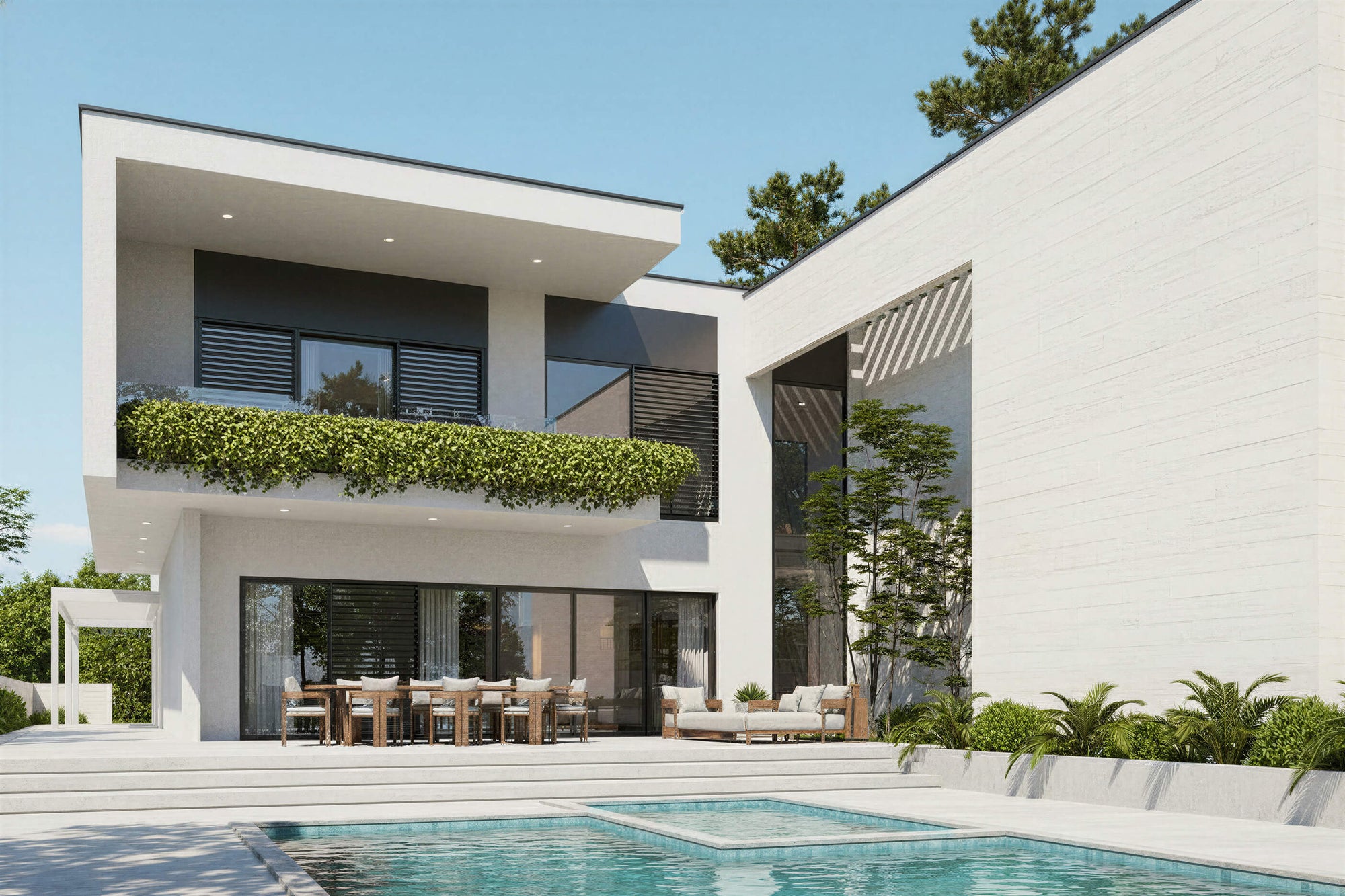 Modern white house with a pool and outdoor furniture on a clear day