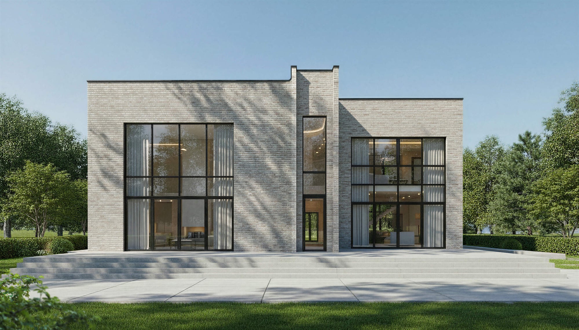 Modern house with large glass windows and a clear blue sky