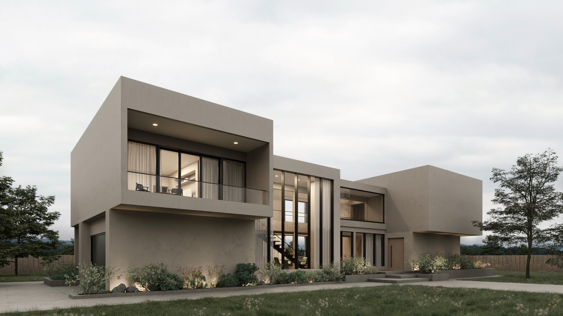 Modern house with a neutral facade and large windows on a cloudy day.